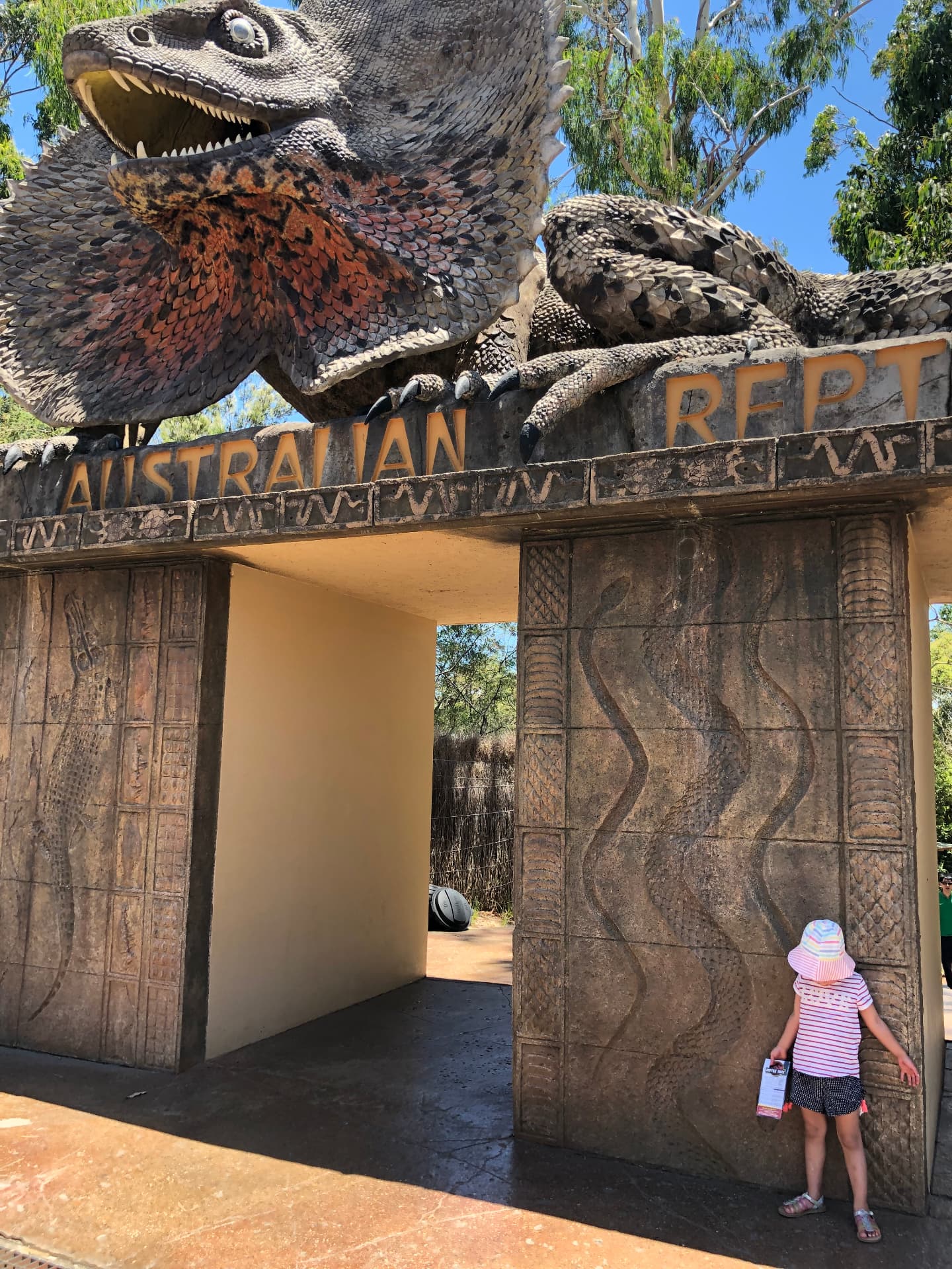 The frilled lizard sculpture above the entrance gates to the Australian Reptile Park at Somersby